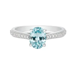 Anillo de oro blanco con diamantes 0,17 quilates y topacio azul