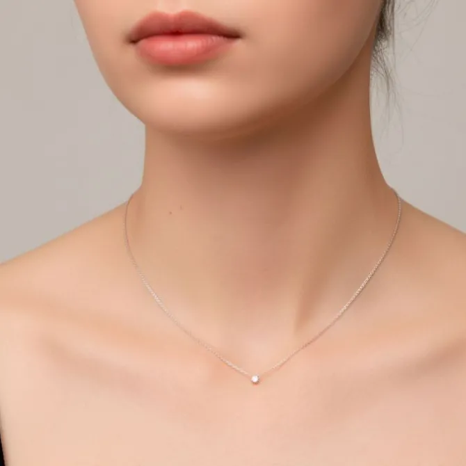 Colgante de oro blanco y diamante 0.30 quilates