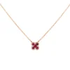 Colgante flor de oro rosa con diamantes 0.18 quilates y rubíes 0.78 quilates