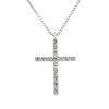 Colgante oro blanco con cruz de diamantes talla brillante 0,07 quilates